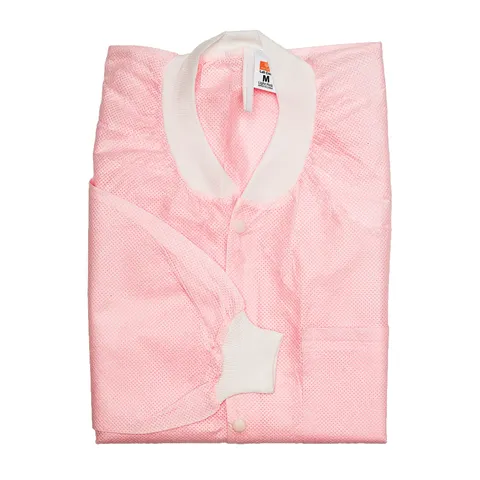 Folded pink quilt with white trim on a white background medium