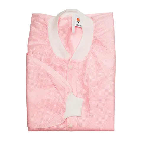 Folded pink quilt with white trim on a white background