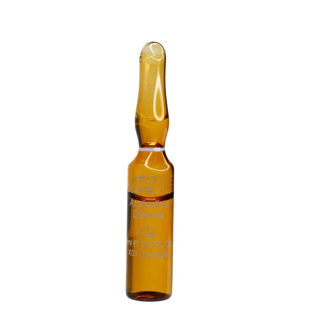 Amber glass ampoule on a white background