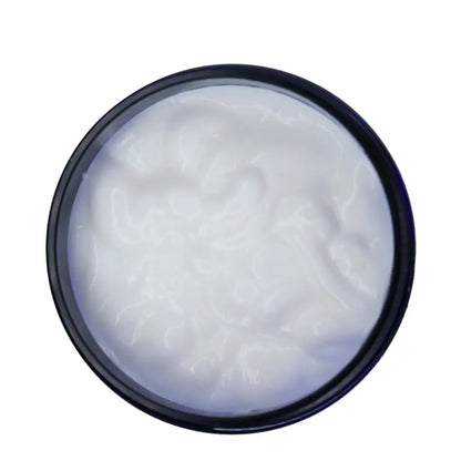 White cream in a blue container on a white background